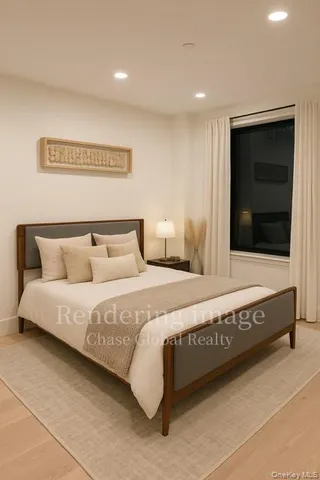 a bedroom with a large bed and a large mirror