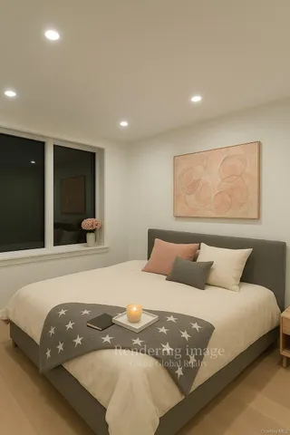 a kitchen with kitchen island granite countertop a sink a stove a microwave and wooden cabinets