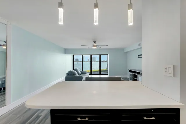 a room with a bed and a large window