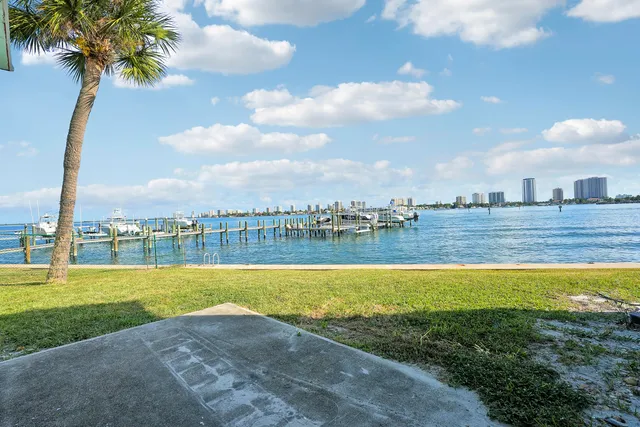 a view of a swimming pool and a yard