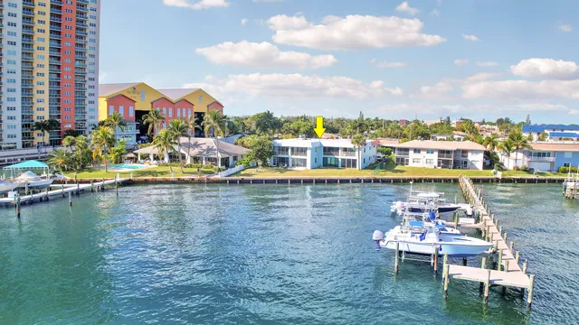 a view of a lake with a table and chairs