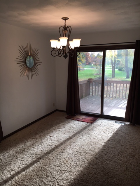 4091 Montclair Road Roscoe, IL 61073 - Photo 4 of 12 a view of empty room with wooden floor and fan