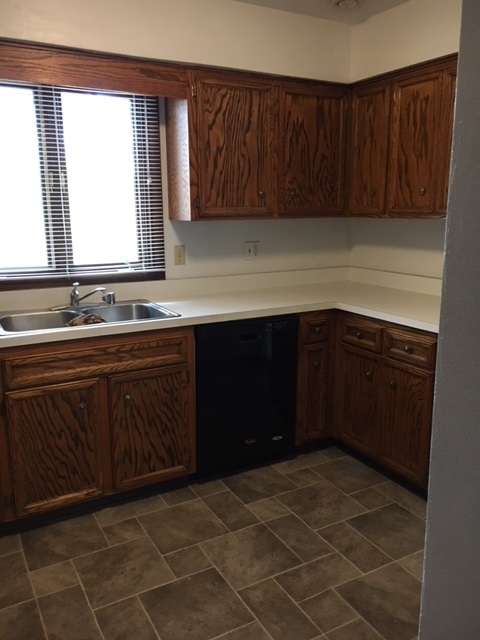 4091 Montclair Road Roscoe, IL 61073 - Photo 7 of 12 a kitchen with a sink a stove and cabinets