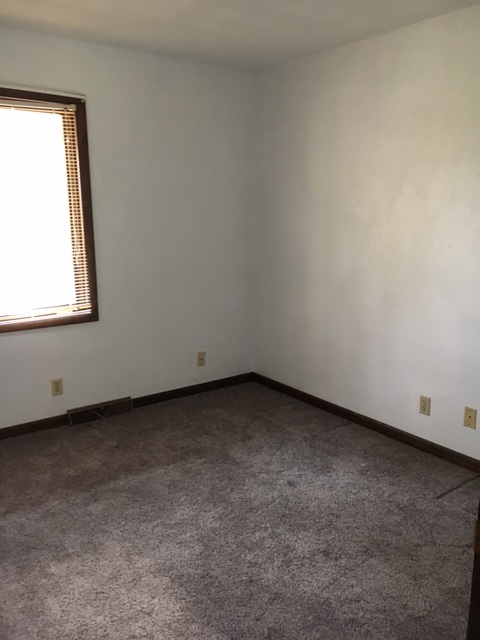 4091 Montclair Road Roscoe, IL 61073 - Photo 9 of 12 an empty room with a window