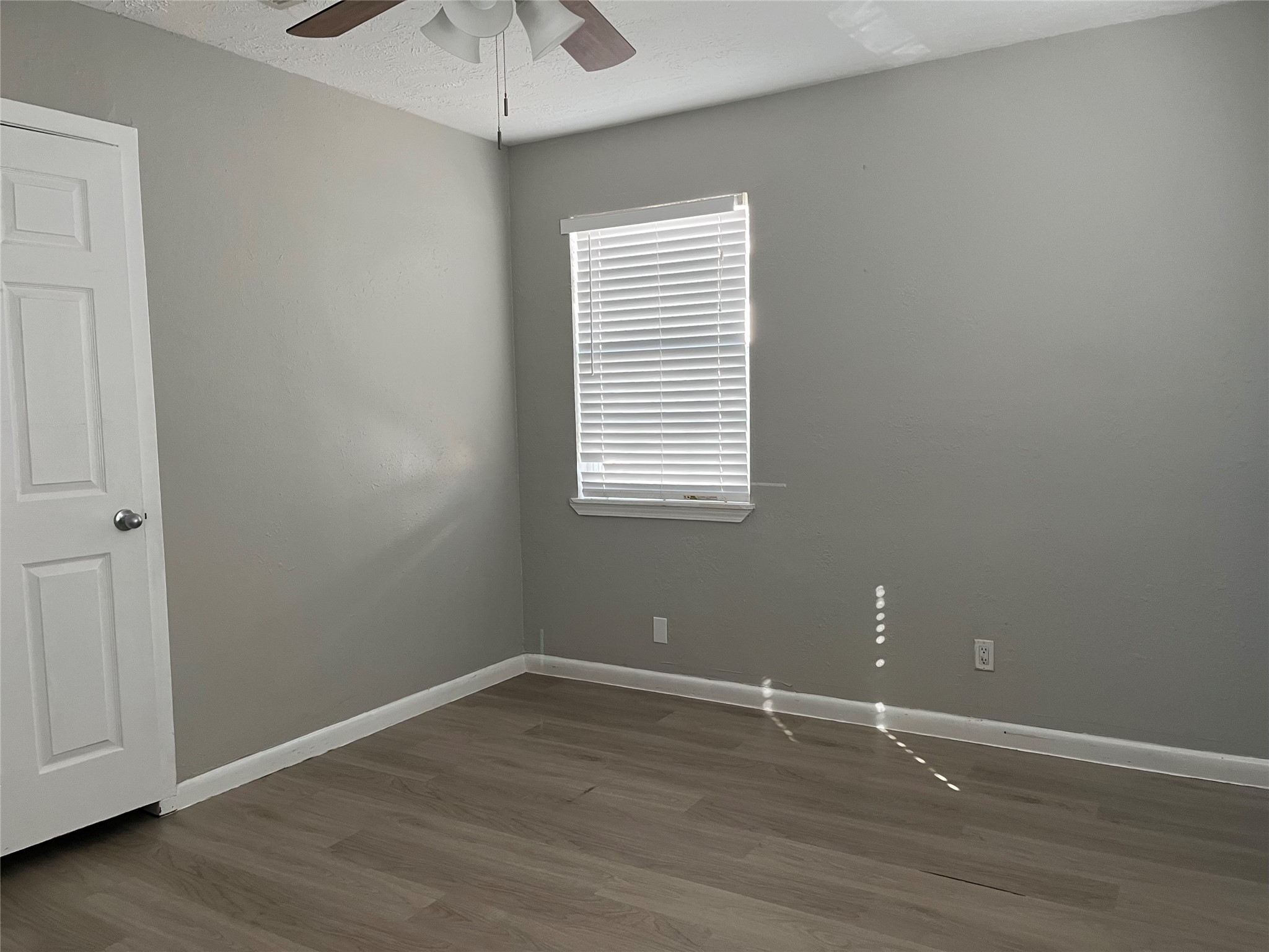 13125 Joliet Street Houston, TX 77015 - Photo 18 of 39 wooden floor and window in an empty room