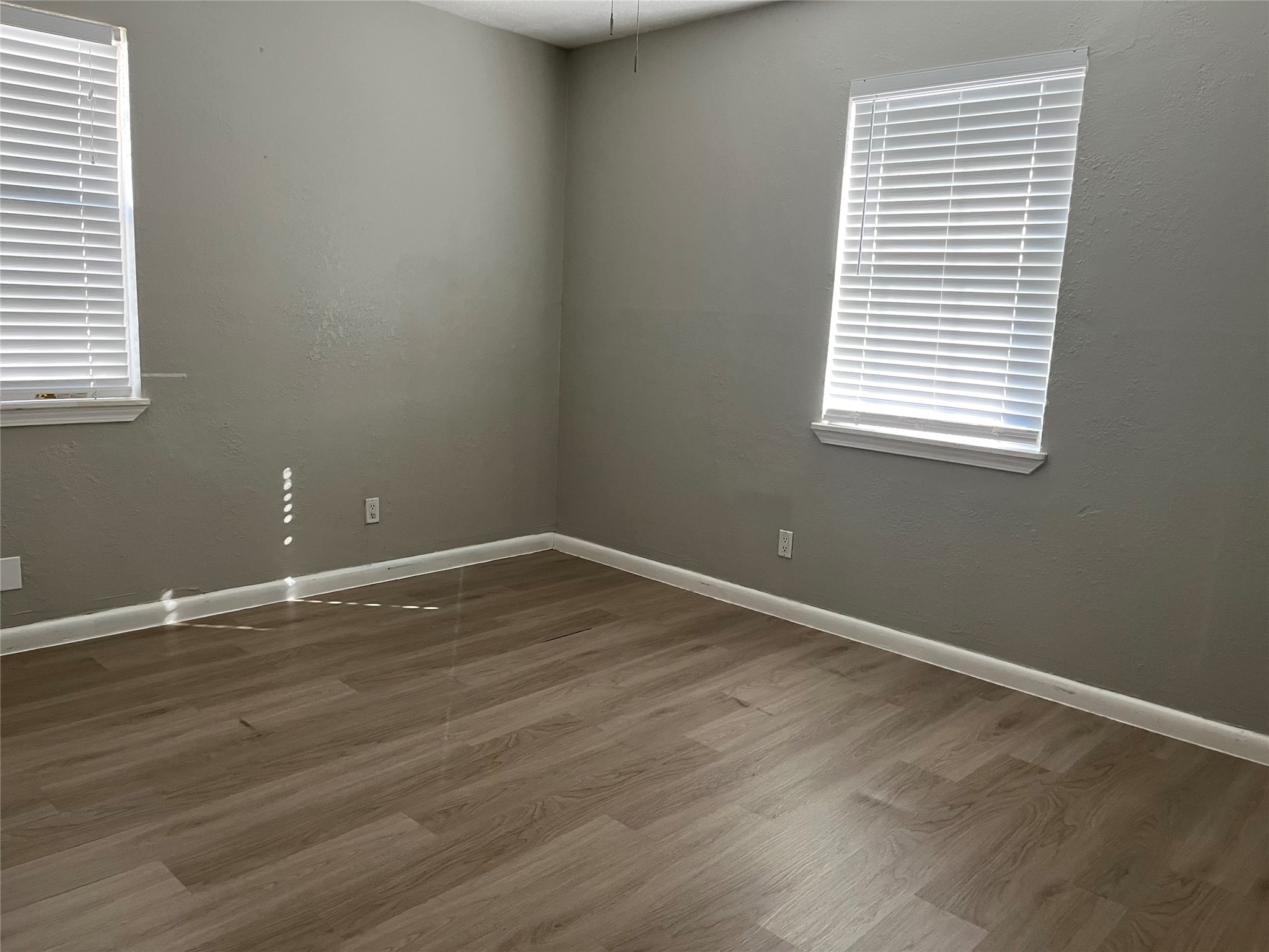 13125 Joliet Street Houston, TX 77015 - Photo 21 of 39 wooden floor and window in an empty room