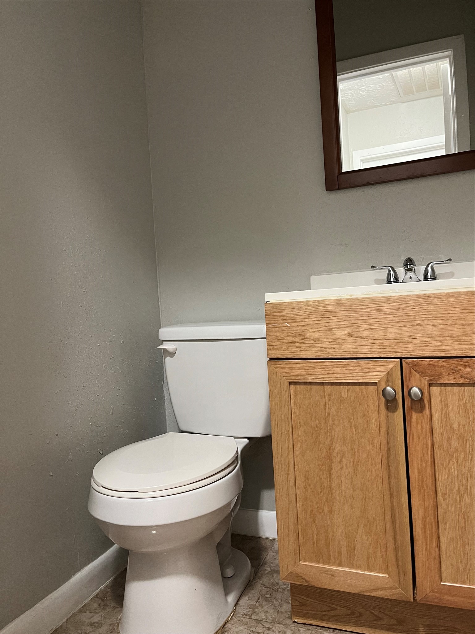 13125 Joliet Street Houston, TX 77015 - Photo 27 of 39 a bathroom with a toilet a sink and mirror