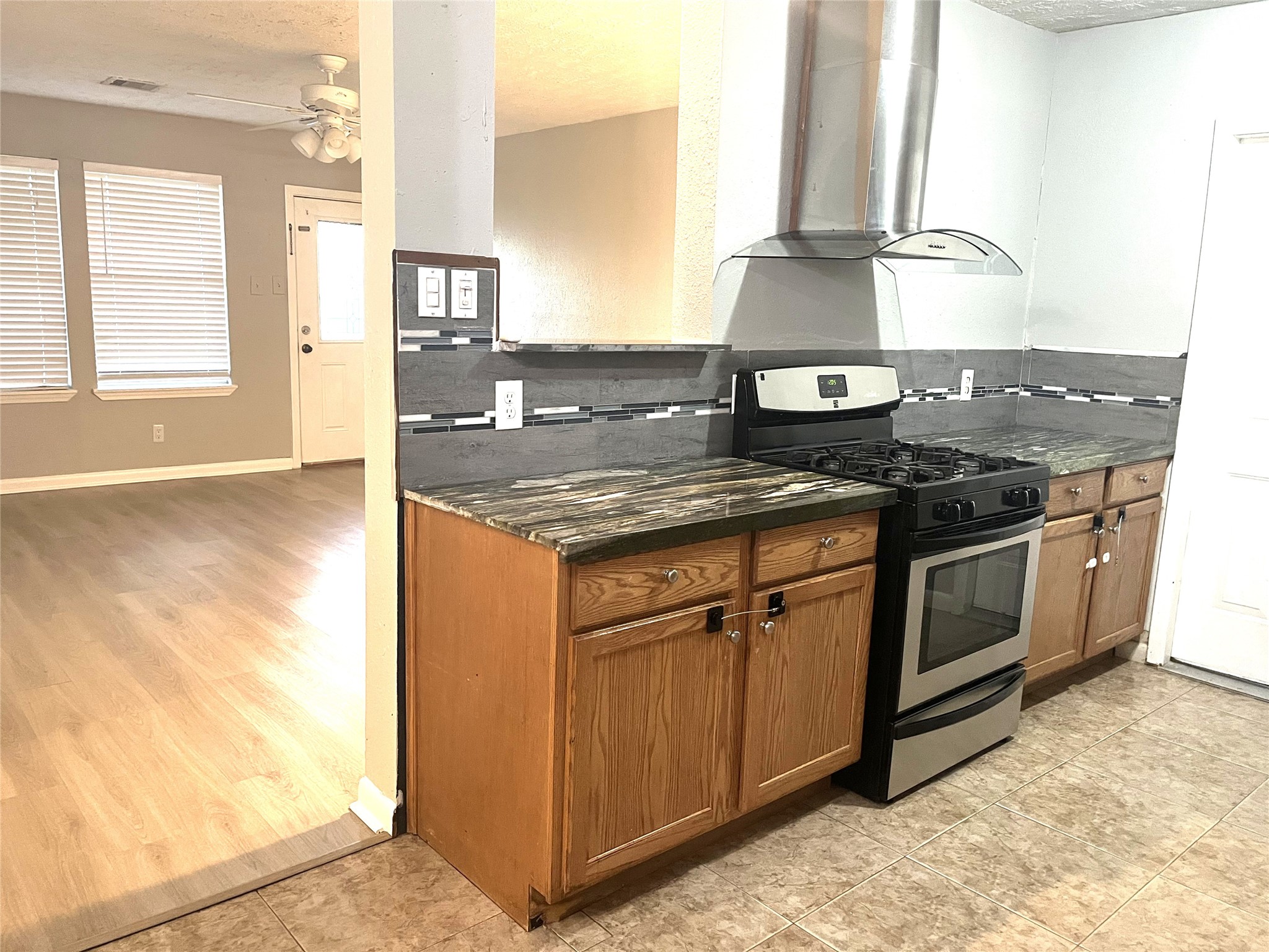 13125 Joliet Street Houston, TX 77015 - Photo 6 of 39 a kitchen with stainless steel appliances granite countertop a stove a sink and a microwave