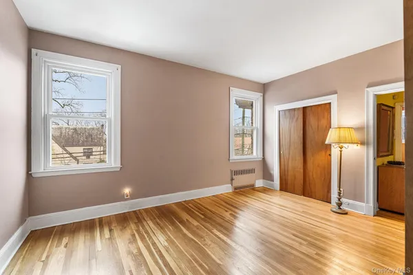 a view of hallway with wooden floor
