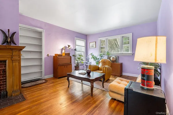 a living room with furniture and a lamp