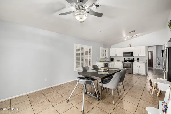 a view of a dining room with furniture