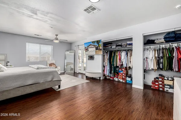 a bedroom with furniture and a window