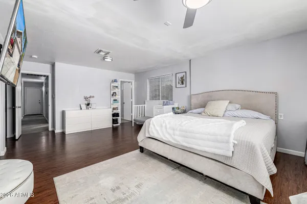 a bedroom with a bed and a table