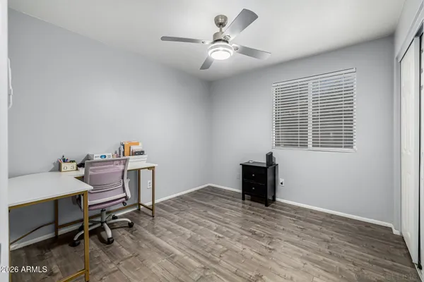 a workspace with furniture window and wooden floor