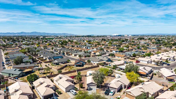 an aerial view of residential building with parking space