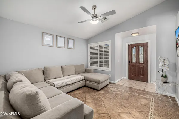 a living room with furniture and a window