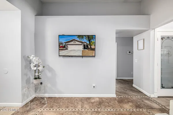 a view of a hallway with paintings on the wall