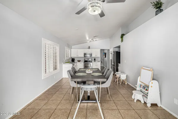 a dining room with furniture and window