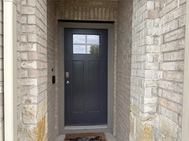 a bathroom with a shower and a sink