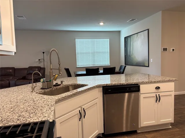 a view of houses with outdoor space and lakeside