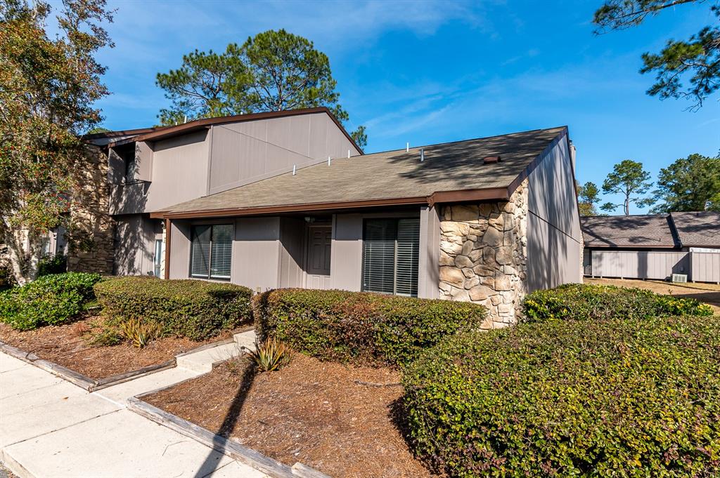3746 Northwest 53rd Road Gainesville, FL 32653 - Photo 1 of 1 a front view of a house with a garden