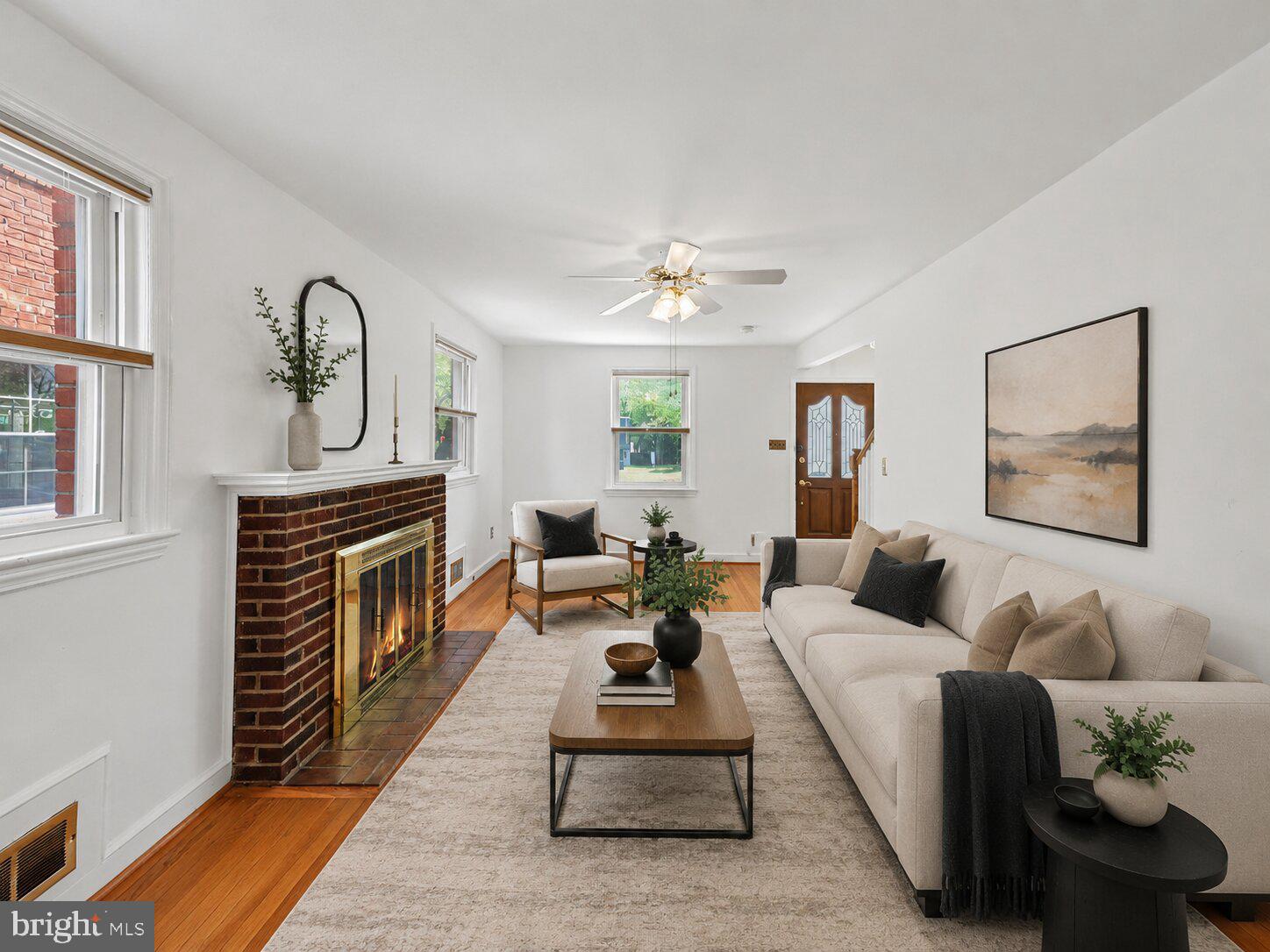 4504 20th Street Northeast Washington, DC 20018 - Photo 15 of 48 a living room with furniture and a fireplace