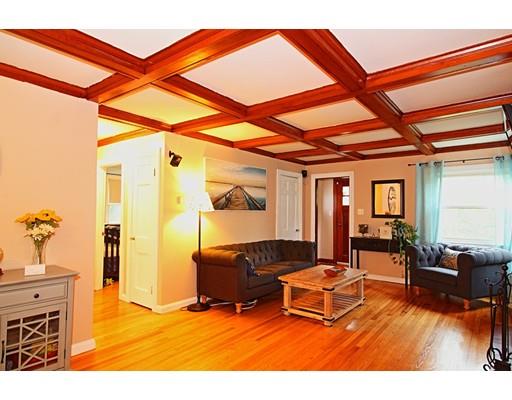 4 Jr Avenue Methuen, MA 01844 - Photo 8 of 23 a living room with furniture a flat screen tv and a table