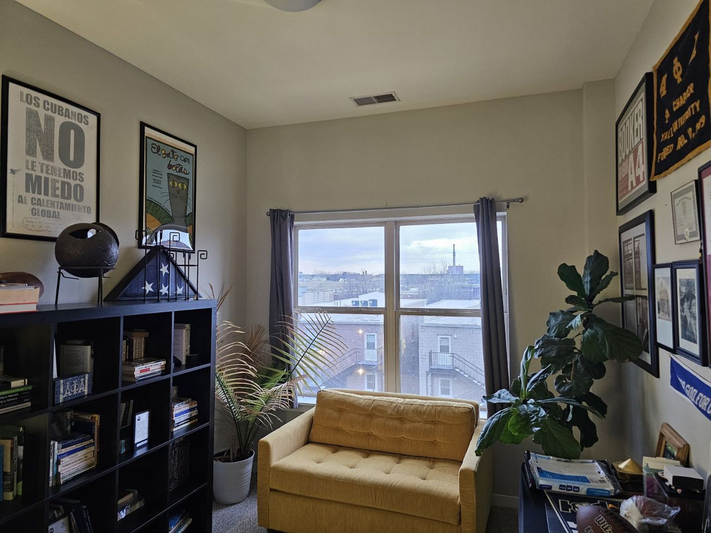 1155 West Roosevelt Road, Unit 403 Chicago, IL 60608 - Photo 7 of 19 a living room with furniture and a potted plant