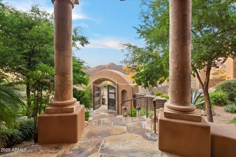 a living room with furniture large window and a fireplace