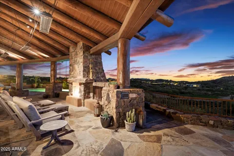 a view of a chairs and table in a patio
