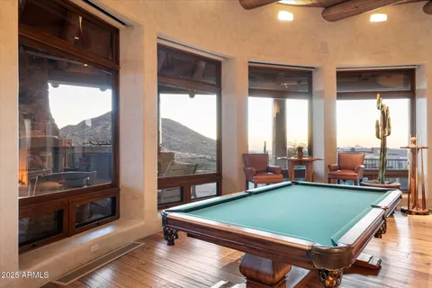 a bedroom with a large bed and a dresser