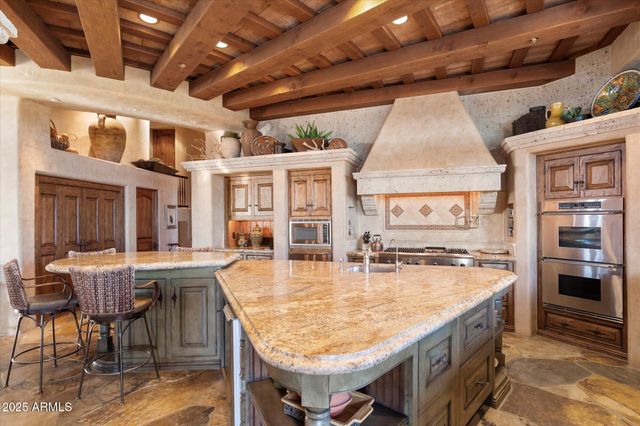 a view of a terrace with a table and chairs