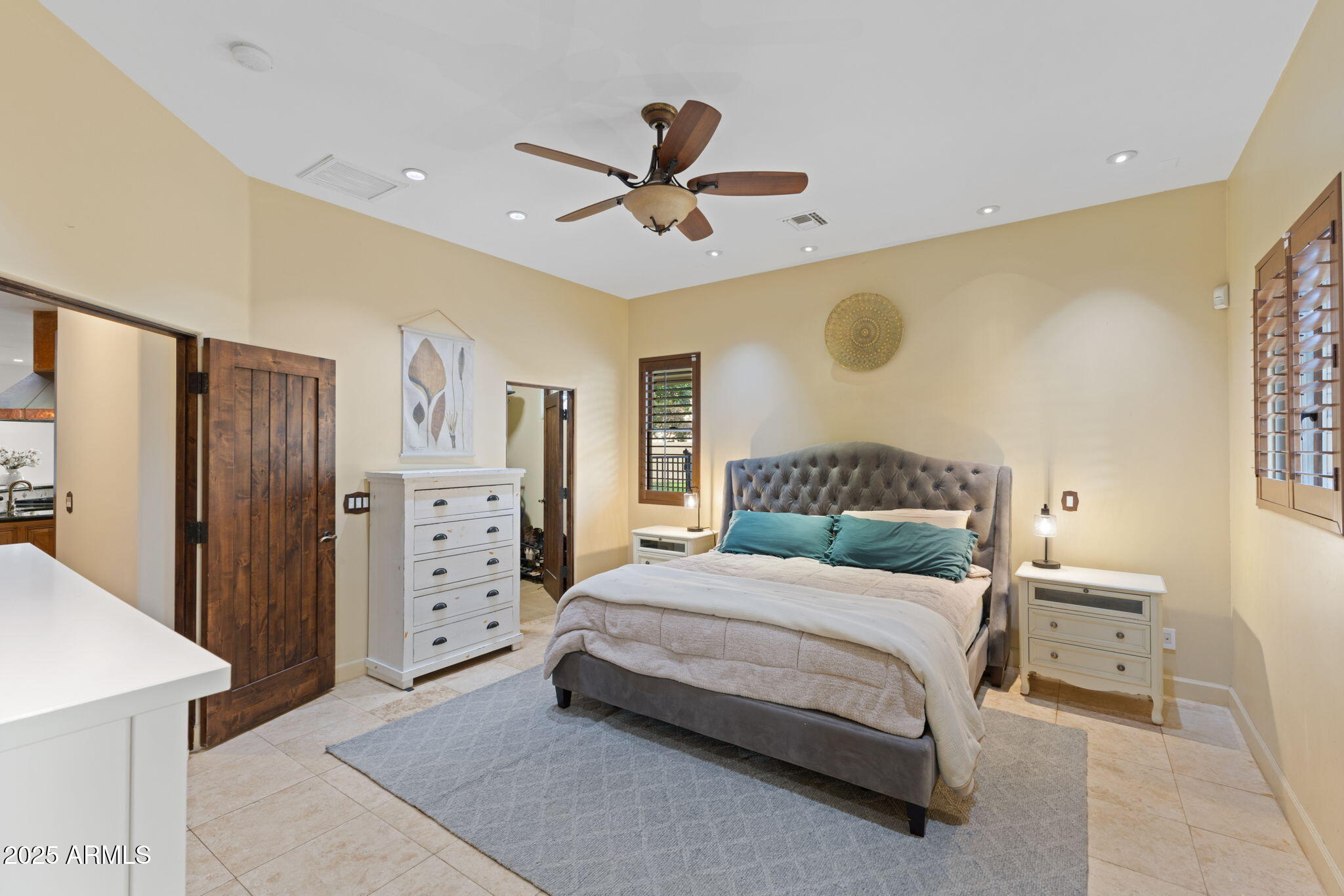 8821 North 9th Avenue Phoenix, AZ 85021 - Photo 12 of 36 a bedroom with a bed and a chandelier