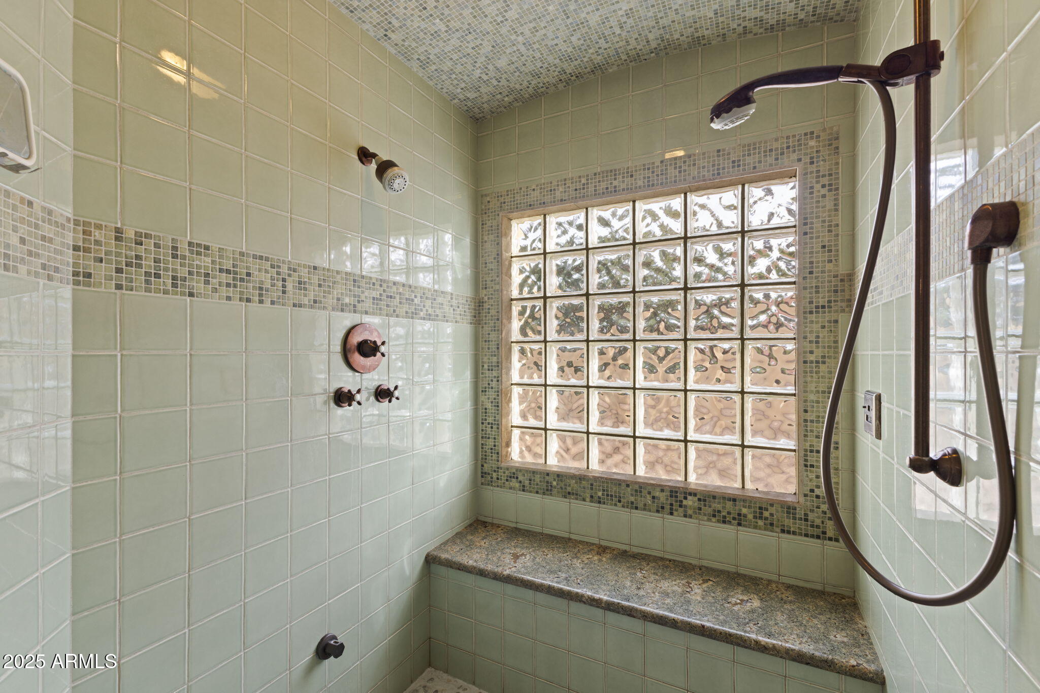 8821 North 9th Avenue Phoenix, AZ 85021 - Photo 16 of 36 a bathroom with a granite countertop sink a window and a glass door shower