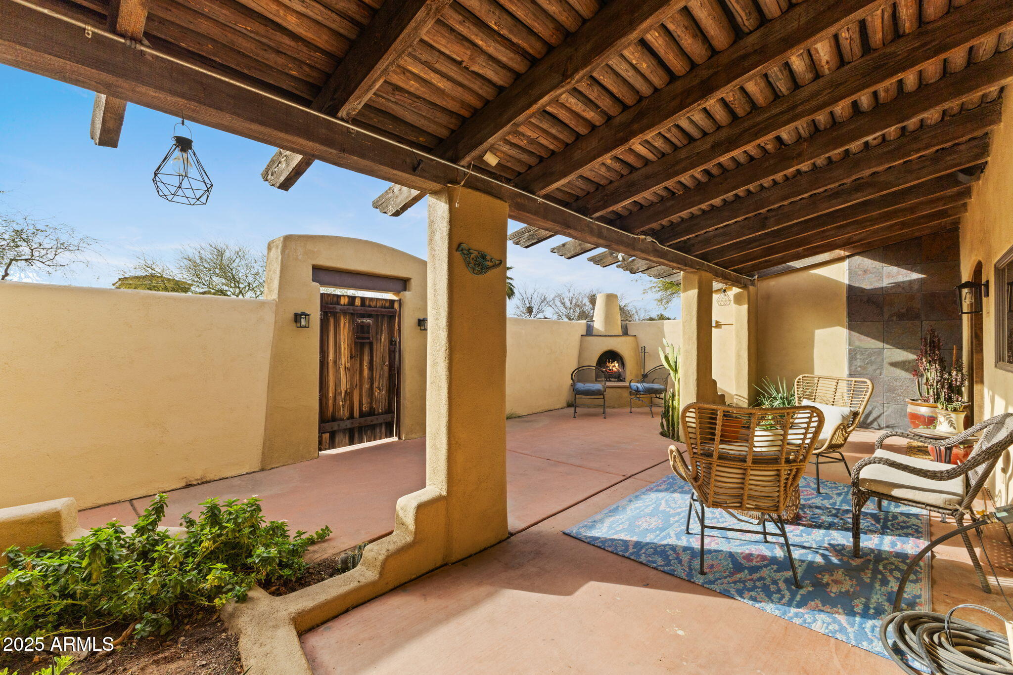 8821 North 9th Avenue Phoenix, AZ 85021 - Photo 2 of 36 a view of a porch with furniture and a potted plant
