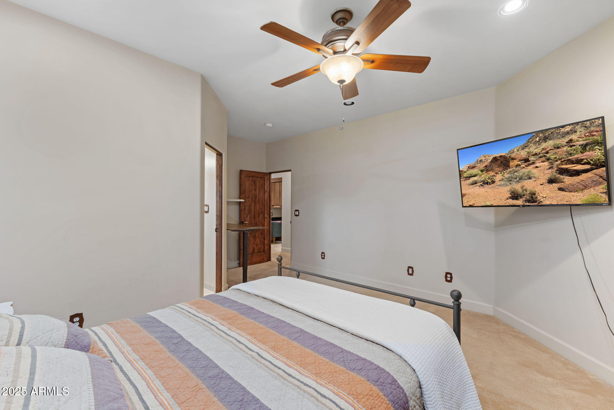 8821 North 9th Avenue Phoenix, AZ 85021 - Photo 21 of 36 a bedroom with a large bed and a chandelier