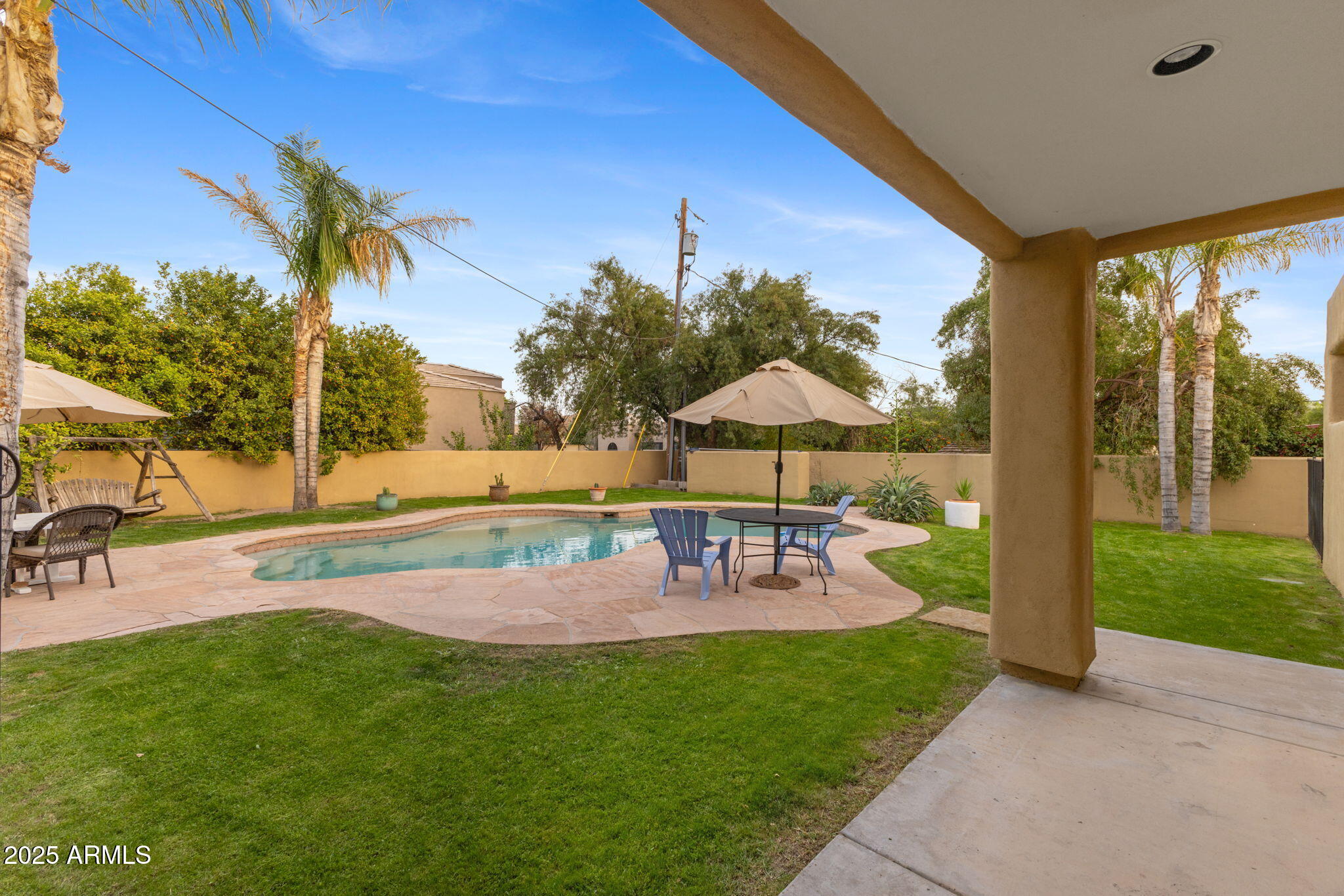 8821 North 9th Avenue Phoenix, AZ 85021 - Photo 31 of 36 a view of a swimming pool with a patio