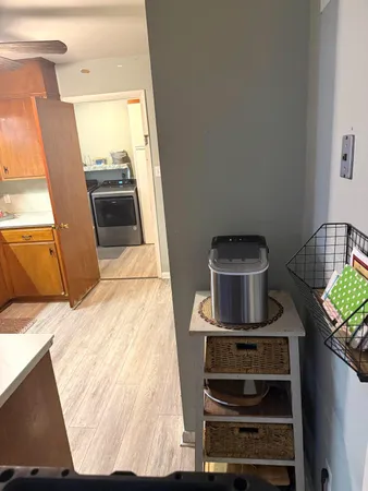 a kitchen with a stove and a refrigerator