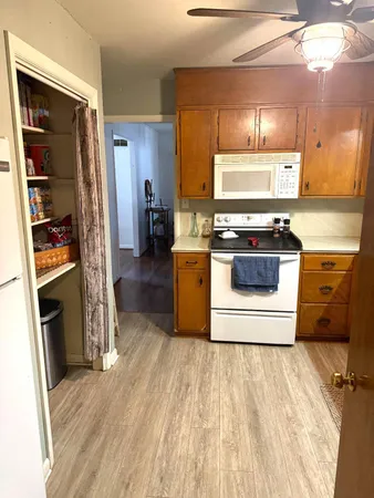 a kitchen with a stove and a refrigerator