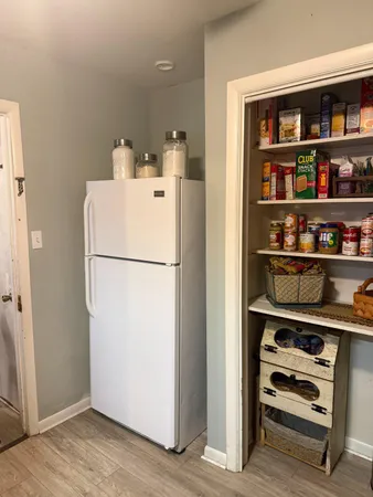 a utility room with closet dryer and washer