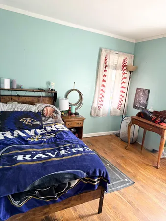 a bedroom with a bed and a dresser