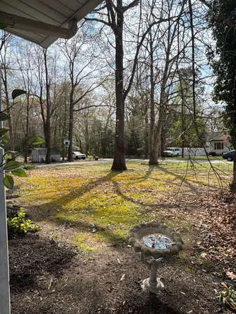 a view of swimming pool with a yard