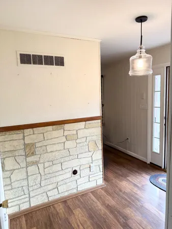 a view of a utility room with wooden floor
