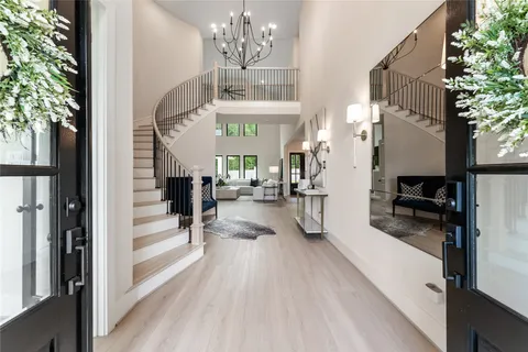 a view of a living room and entry way