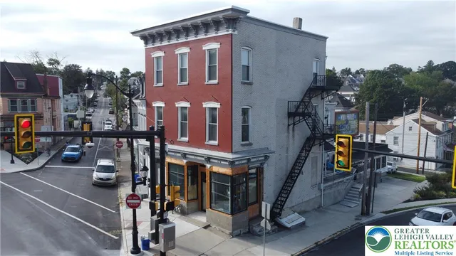 a view of a street with cars