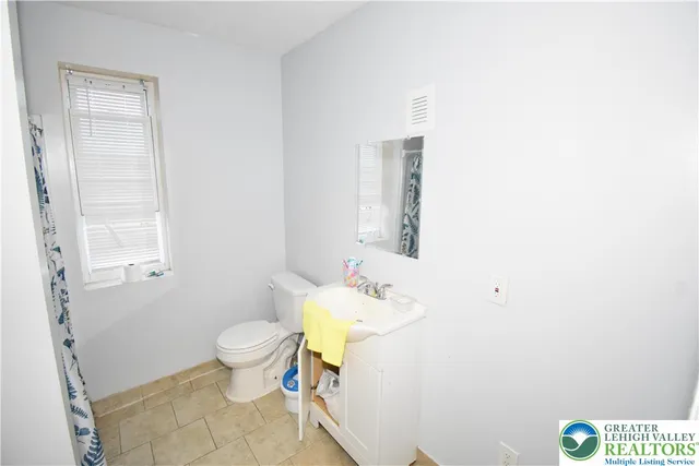 a livingroom with furniture and a large window