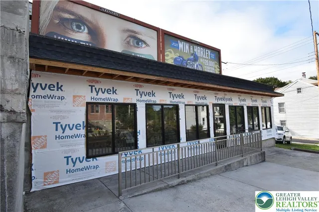a view of an empty room with wooden walls
