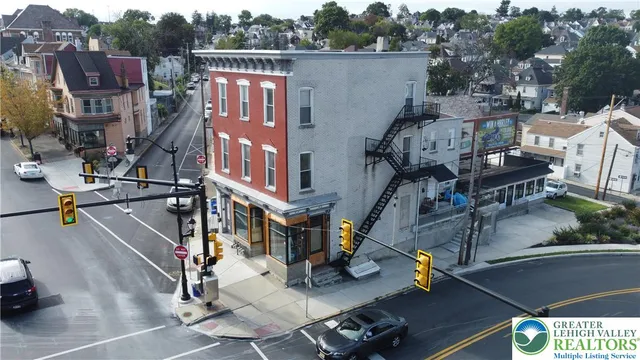 an aerial view of a building with parking area