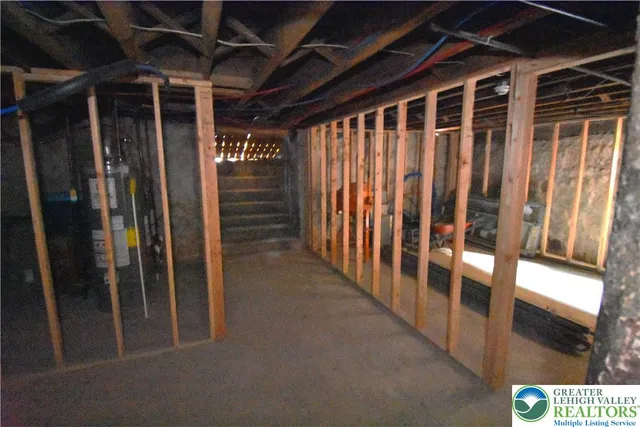 a view of an empty room with stairs