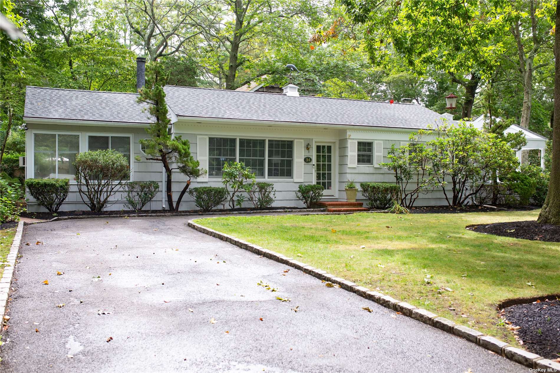54 Mill Road Remsenburg, NY 11960 - Photo 1 of 1 a view of a house with swimming pool and sitting area